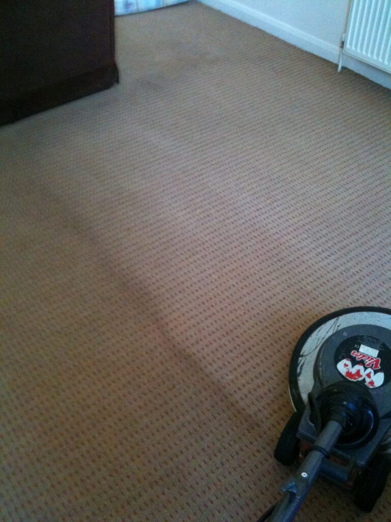 Low-moisture carpet cleaning